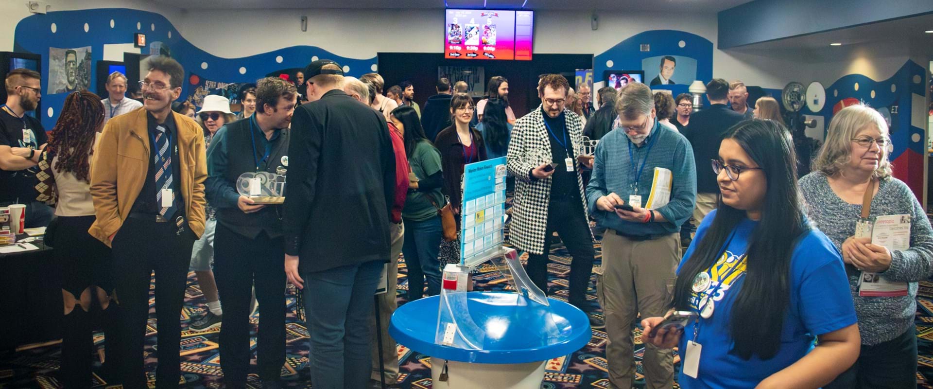 Filmmakers and guests gather in the large lobby after a full screening.